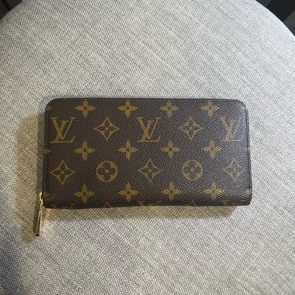 LV Wallet 100% authentic. Poshmark will authenticate the item.